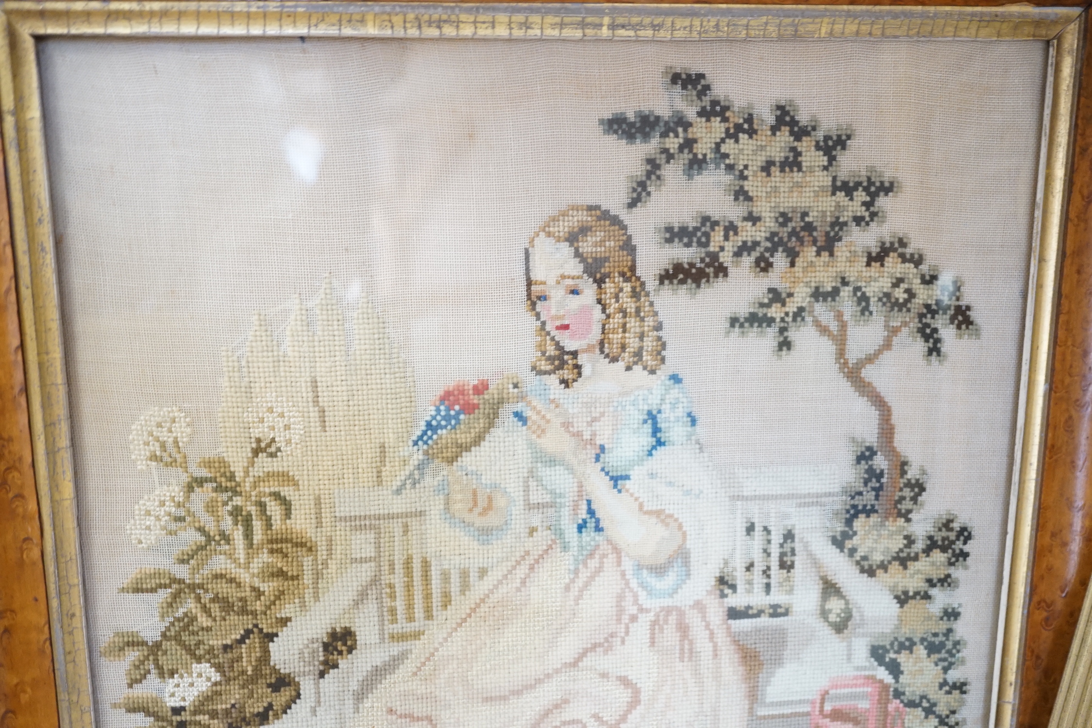A framed Regency embroidery, two later figurative embroideries and a pair of embroidered slipper fronts, Regency embroidery 37cm wide, 41cm high